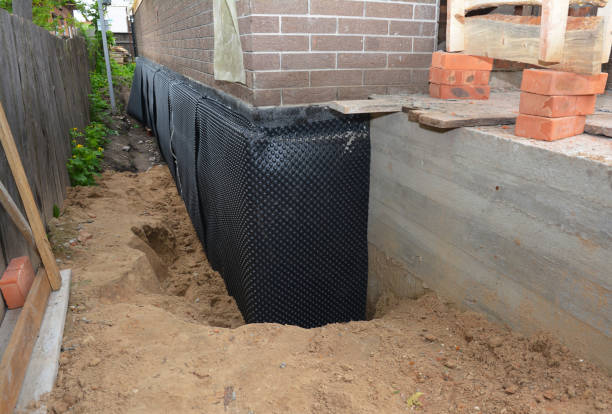 Happy homeowners after waterproofing job in New Hampshire